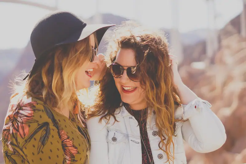 Two friends laughing together