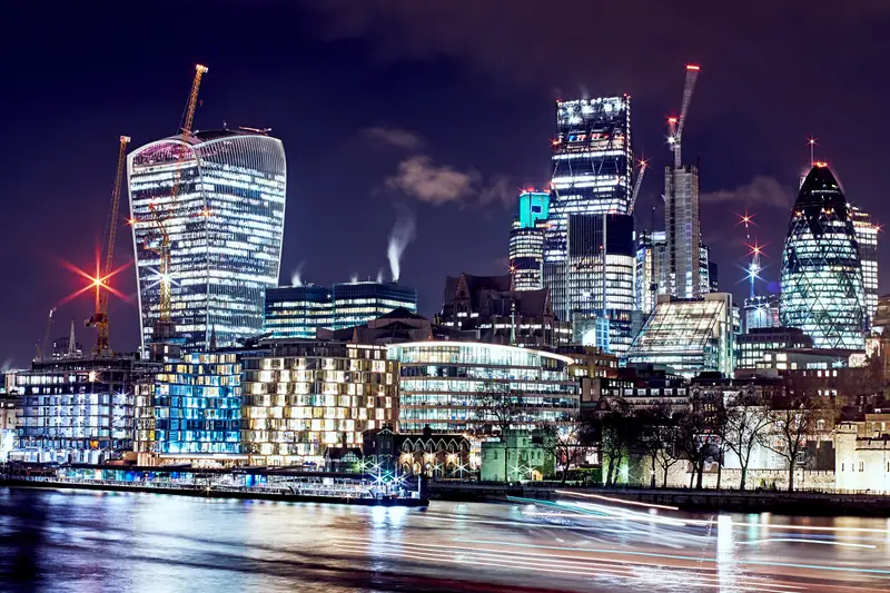 The City of London skyline seen from the River Thames at night